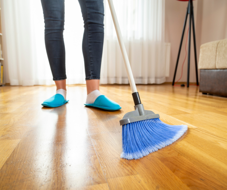 broom cleaning a home