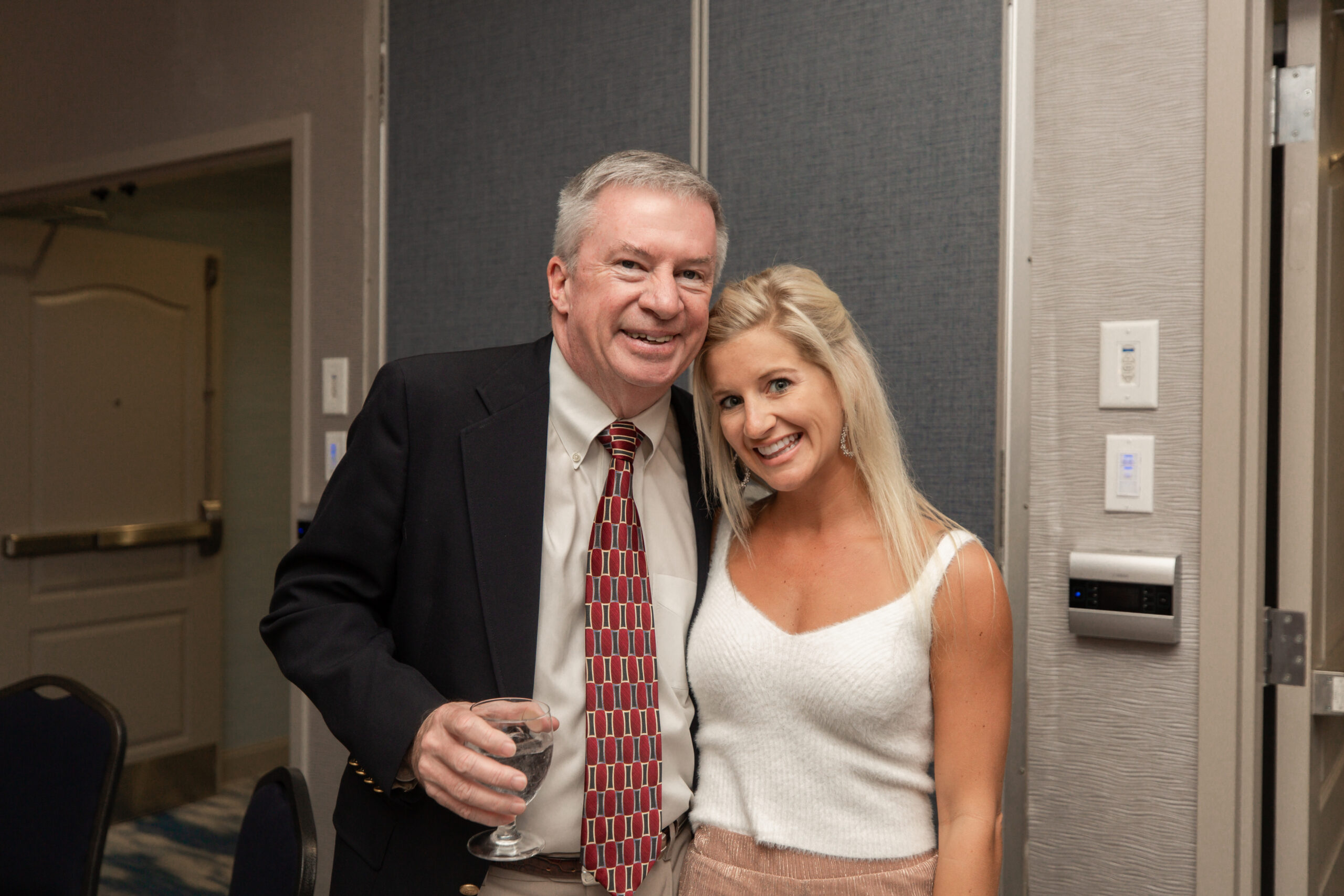 Broker-in-Charge Jim Parker with Broker Associate Britni Belair enjoying the office Christmas party