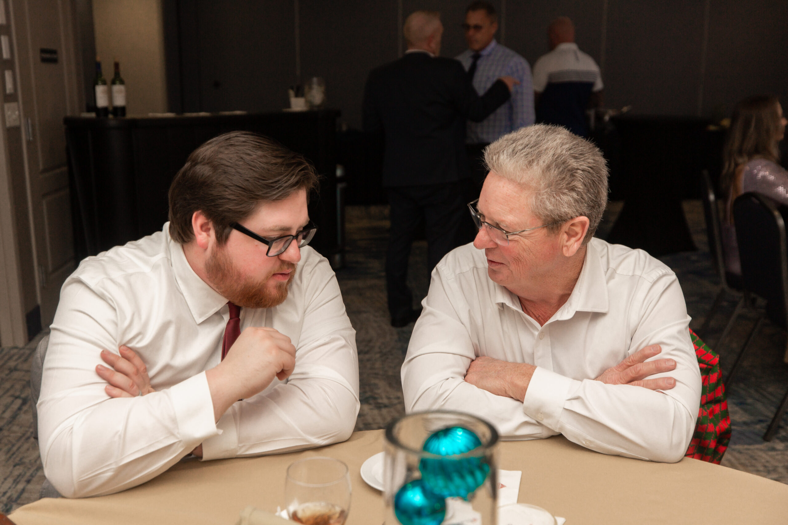 Father and son in deep conversation! Realtors Jeff and Robert Wiltcher