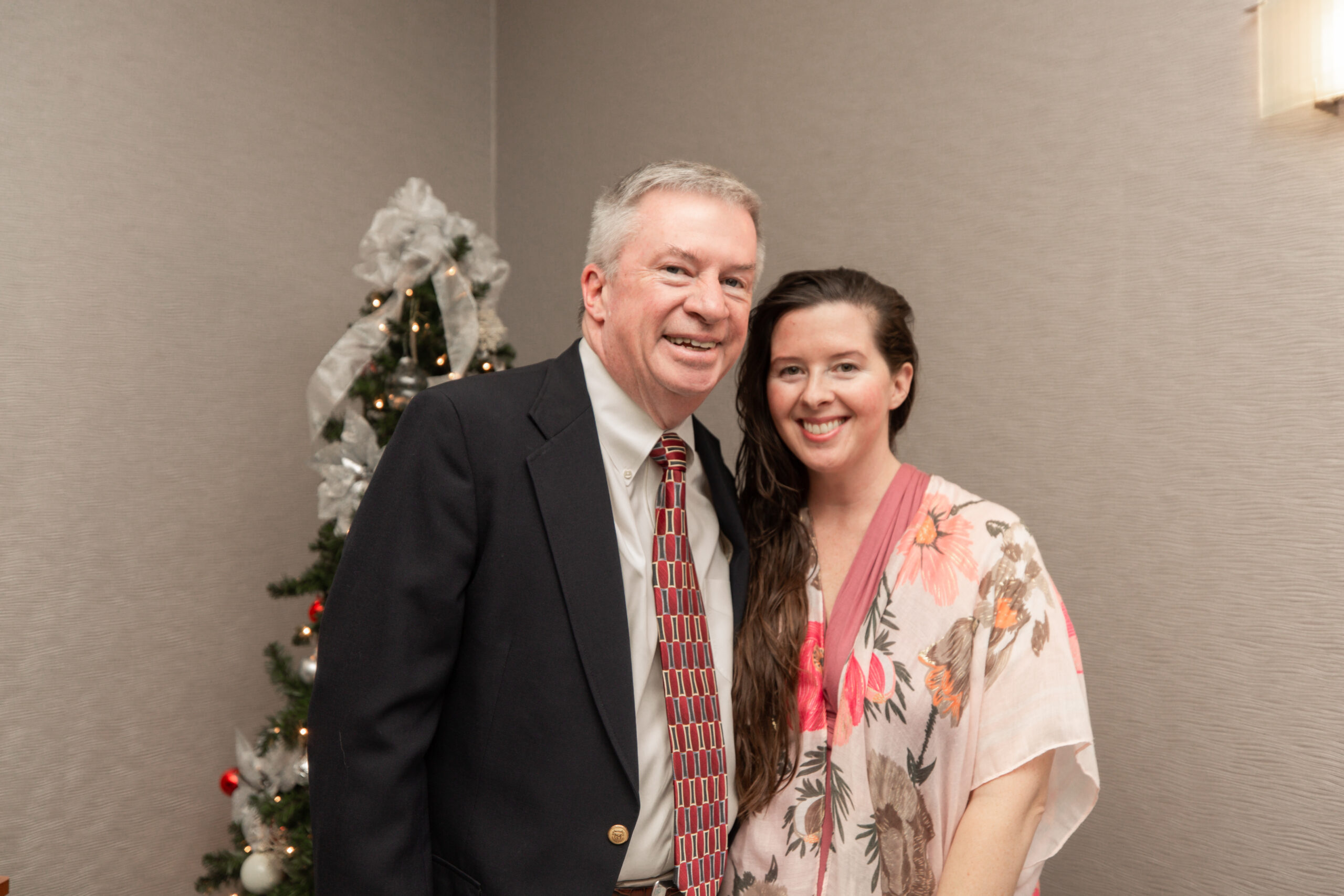 Broker-In-Charge Jim Parker and Marketing Director Megan Parker embracing the Christmas spirit